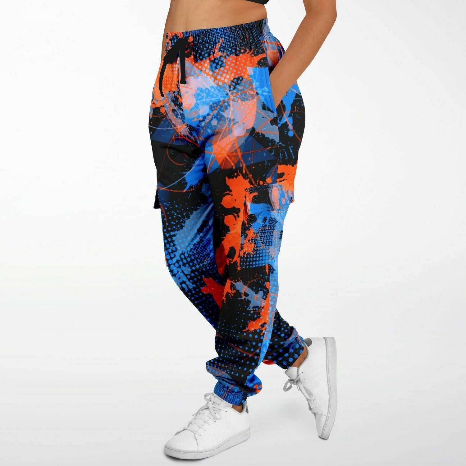 Colorful abstract-patterned pants worn by a person on a white background