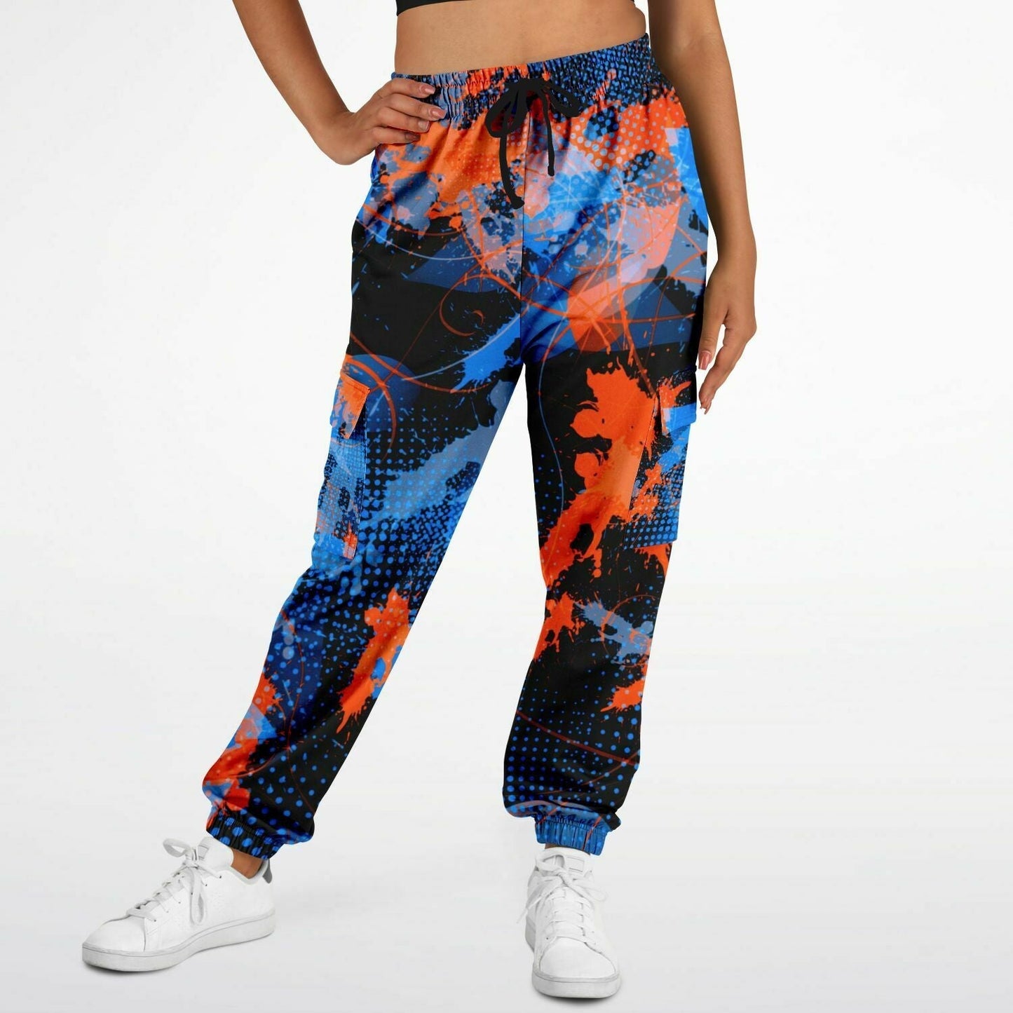 Colorful splatter-patterned pants worn by a person on a white background