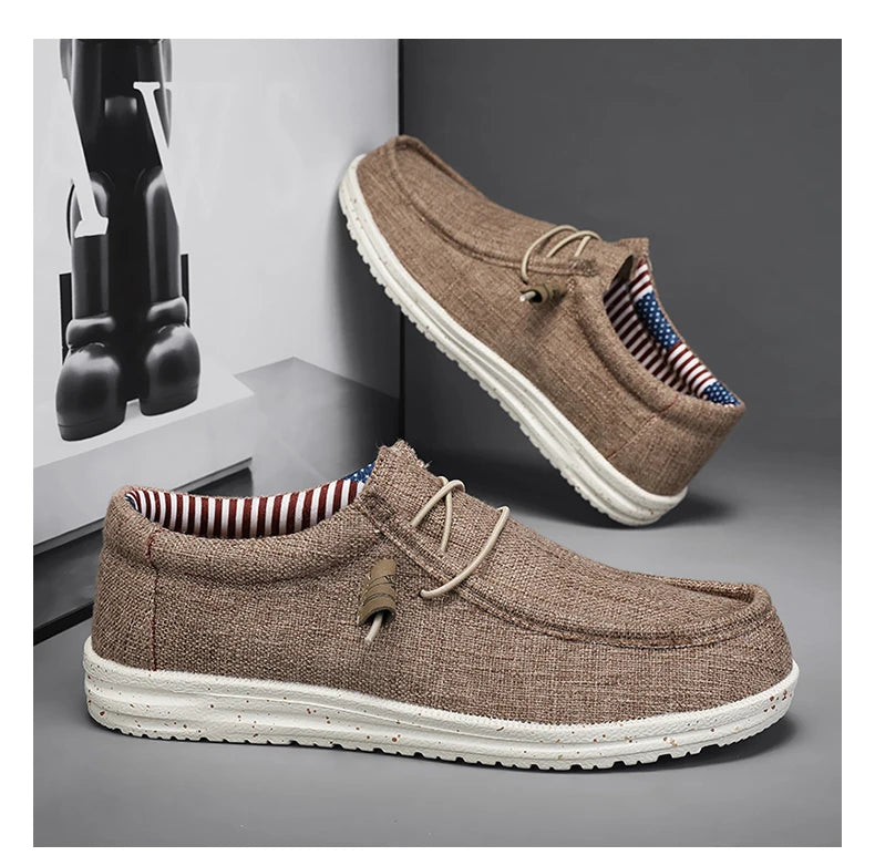 Brown casual shoes with white soles on a gray surface