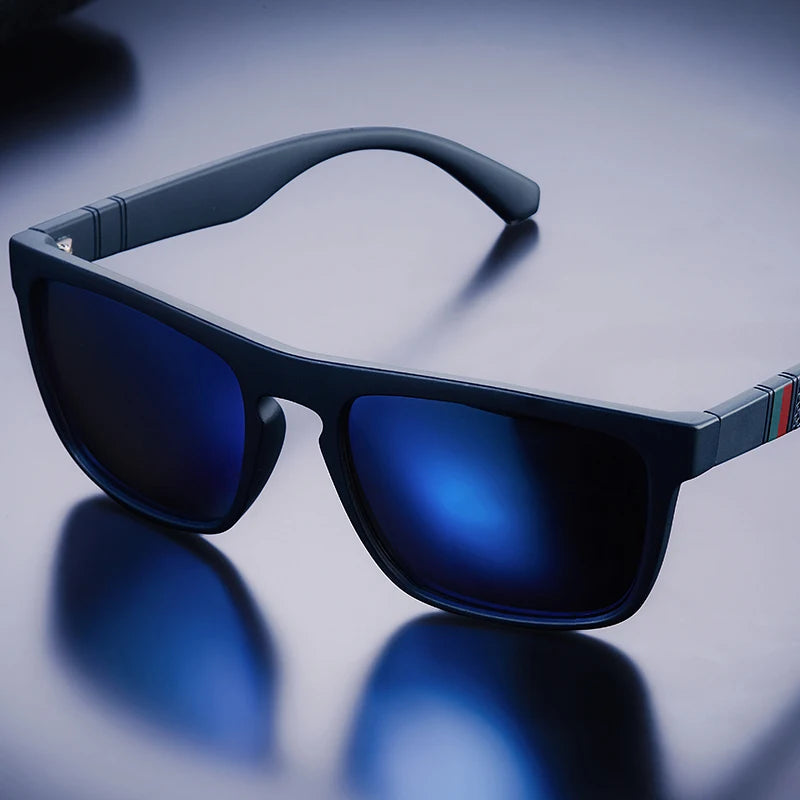 Black sunglasses with blue lenses on a reflective surface