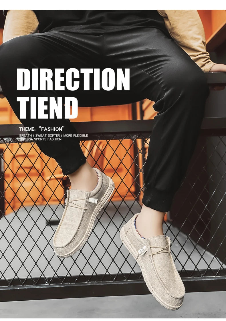 Person wearing beige loafers with black pants sitting on a metal railing.